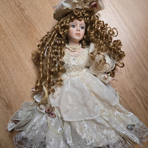 Glass Bride Doll like new with lace dress and hat
