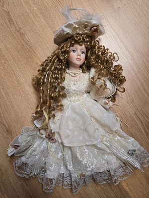 Glass Bride Doll like new with lace dress and hat