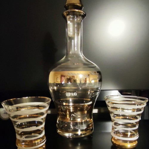 Vintage glass decanter set with 2 glasses used, gold decorations