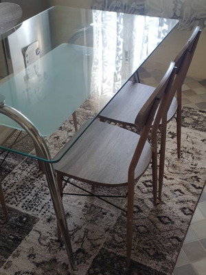 Glass kitchen dining table set with 4 metal-legged chairs