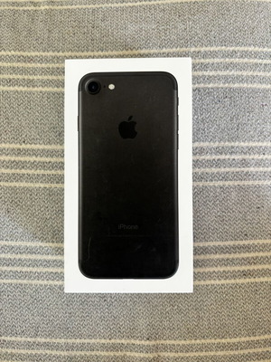 iPhone 7 with 5 cases and 3 screen protectors