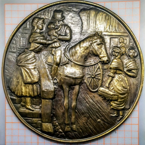 Vintage round brass plate used with embossed scene