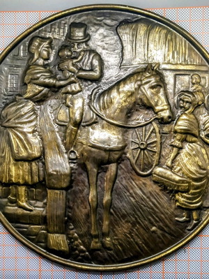 Vintage round brass plate used with embossed scene