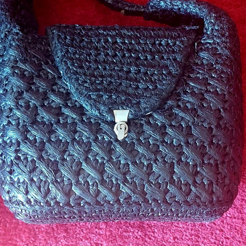 Handmade black raffia handbag used with silver turn-lock clasp