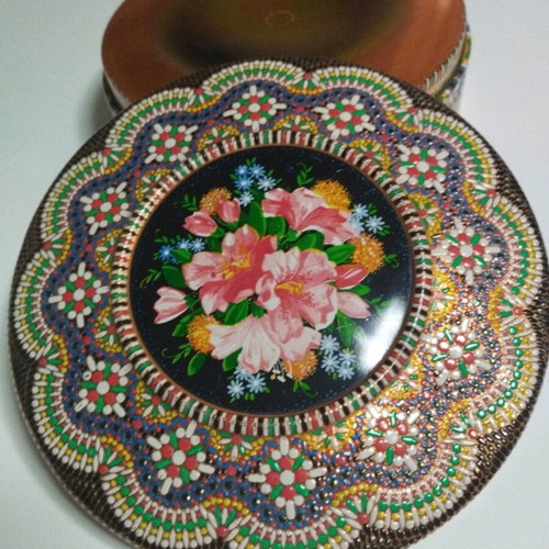 Vintage metal box with embossed floral design and Pointillism mosaic