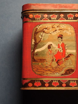 Vintage collectible metal biscuit tin used with Japanese motifs