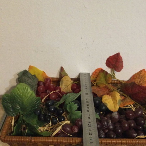 Basket with fake grapes like new
