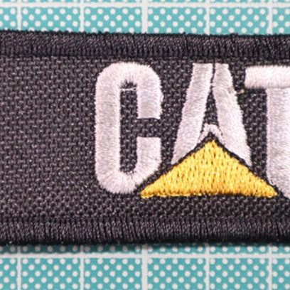 Fabric keychain Truck with embroidered logo 12x3 cm new, black