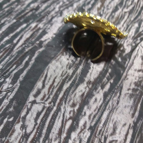 Large ring used, gold color with small strass