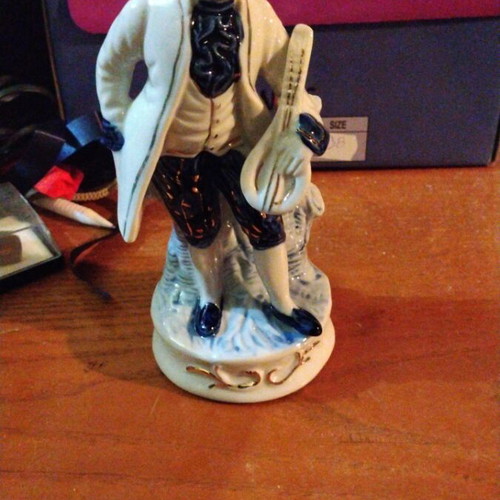 Porcelain figurine of colonial era musician like new, white and blue with gold details
