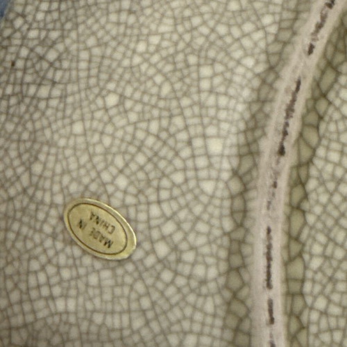 Decorative handmade plate used with embossed design and damage