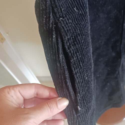 Black corduroy salopette with front and side pockets