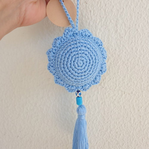 Handmade baby blue crocheted eye decoration