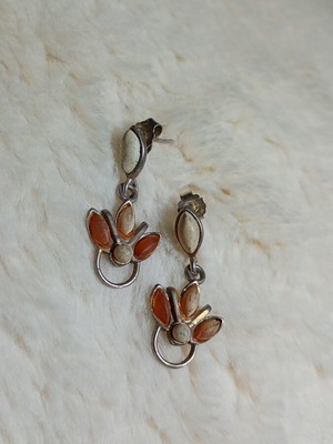 Silver earrings with amber used