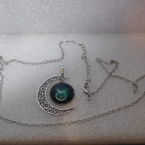 Pendant necklace with Taurus zodiac and crescent moon, like new