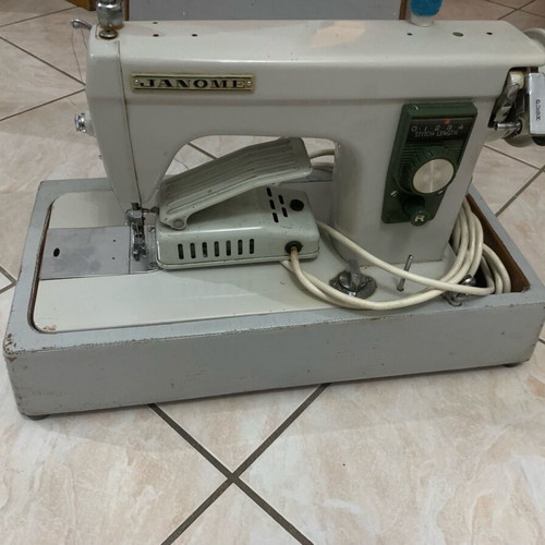Electric collectible sewing machine used with carrying case