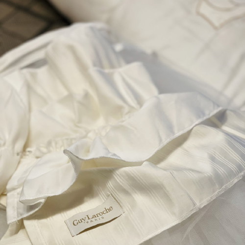 Guy Laroche crib bedding set used with blanket and mosquito net