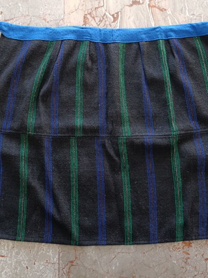 Traditional wide apron with stripes used