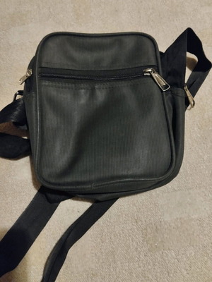Men's bag like new, black with multiple pockets and zippers