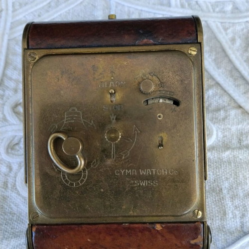 Cyma table clock used, Swiss made, brass with leather