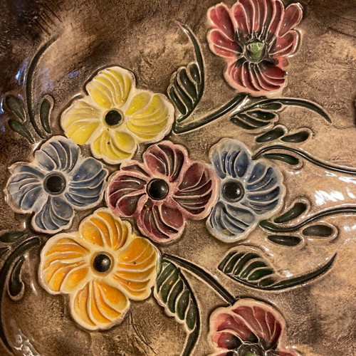 Vintage handmade ceramic bowl with embossed flowers like new