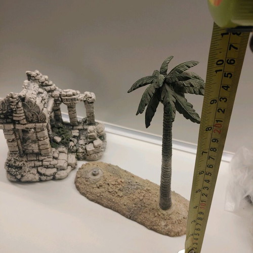 Decorative aquarium rocks used with ancient ruins and palm tree design