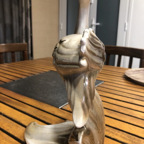 Antique ceramic bird statuette with gold leaf details, 40 years old