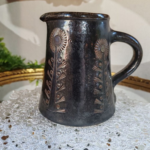 Retro ceramic milk jug with embossed flowers