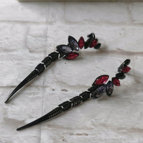 Earrings new, impressive with red and purple stones
