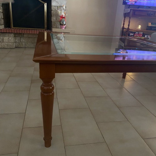 Coffee table with glass top and wooden base