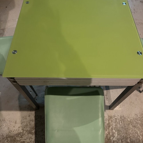 Glass dining table with extension and 4 used chairs, light green