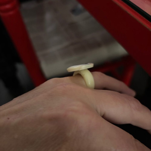 Women's white ring with painted Spira like new