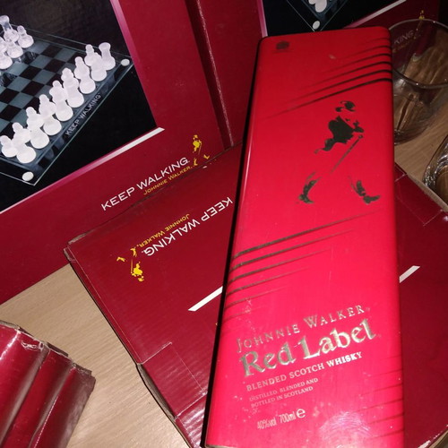 Johnnie Walker collectible set new with chess, whiskey glasses, and metal box