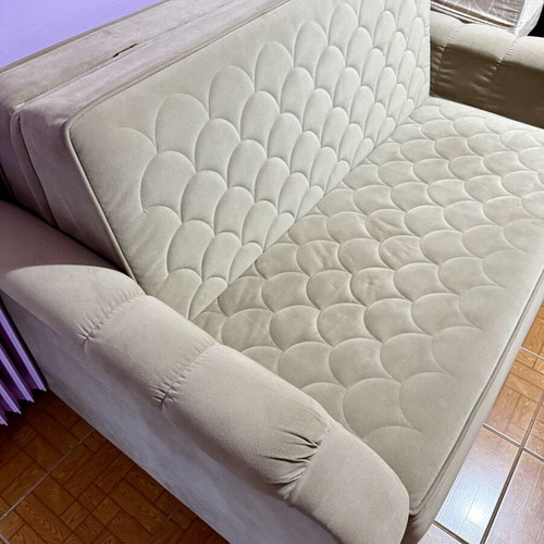 Two-seater sofa light brown/grey like new, folds into a bed