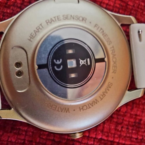 Smart watch, gold with beige strap and black with extra straps