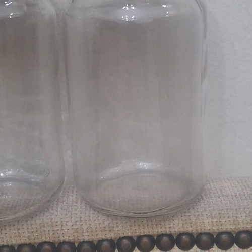 Set of 10 transparent glass storage jars with black metal lids