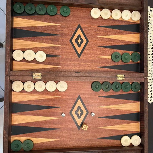 Handmade wooden backgammon used with dice and checkers