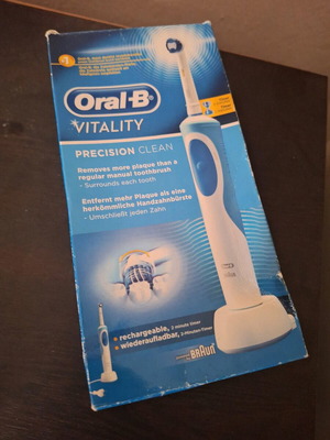 Oral-B Vitality electric toothbrush used