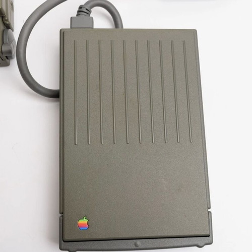 Apple PowerBook 180 laptop used with charger and floppy drive