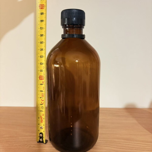 Brown glass pharmacy-style bottle with cap