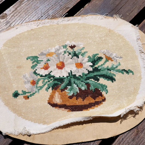 Vintage needlepoint with embroidered daisy bouquet used