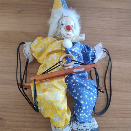 Ceramic clown harlequin acrobat doll on swing like new