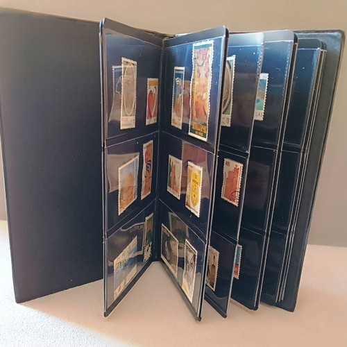 Stamp album with 120 stamps like new, Greece Australia Cyprus Germany America Canada