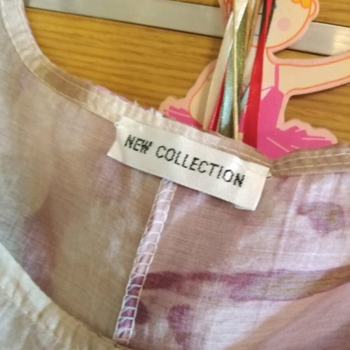 Floral blouse airy like new, longer at the back