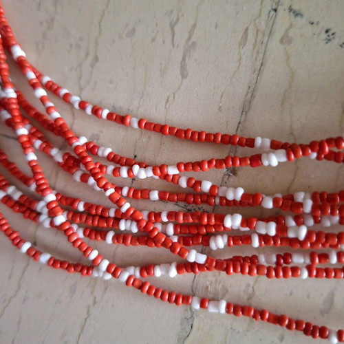 Necklace like new with 10 strands of small coral and white beads