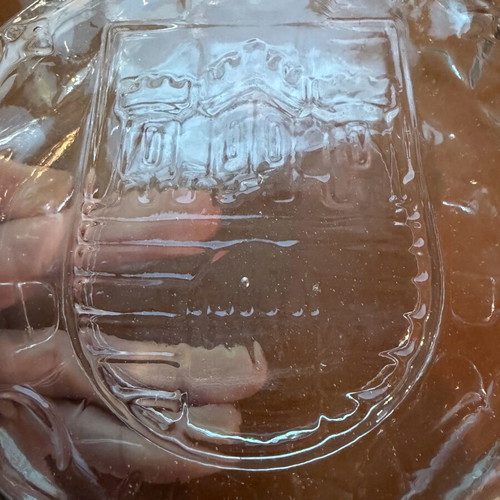 Vintage glass carafe used with embossed castle decorative bottle