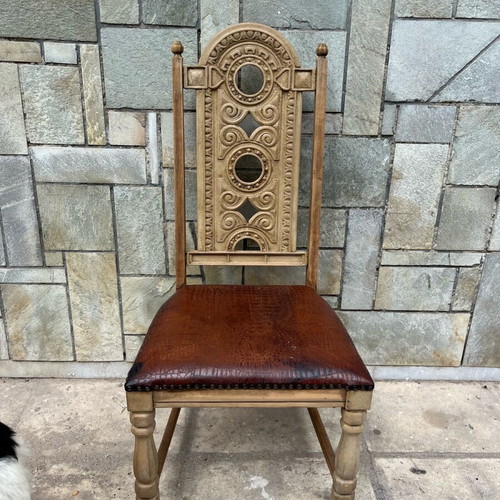 Skyrian carved chair used with replaced leather