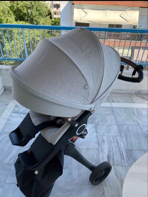 Stokke Xplory stroller used with bag, footmuff, rain cover and carrier