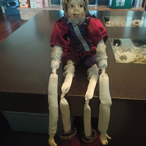 Wind-up Pierrot Harlequin doll used with music