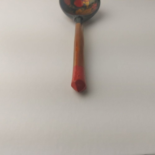 Old painted wooden spoon used